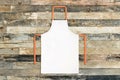 White apron on wooden background