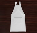 Blank white apron mockup on wood background Royalty Free Stock Photo