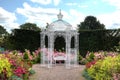 White arbour in a garden