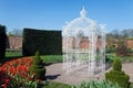 White arbour in a large garden