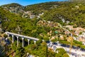 White Arc Bridge, Viaduct of Eze or Devil bridge, over Alpes canyon seen from historic town of Eze over Azure Coast in France Royalty Free Stock Photo