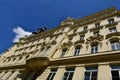 white arched wood windows. yellow stucco elevation. old classic architecture. diminishing perspective Royalty Free Stock Photo