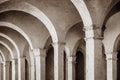 White arches with columns in temple medieval door. Royalty Free Stock Photo