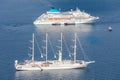 Cruise ship and luxury yacht aerial view, Santorini Greece. Calm blue sea and sea transportation vessels Royalty Free Stock Photo
