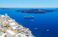 White architecture on Santorini island, Greece. Beautiful landscape with ship and sea view Royalty Free Stock Photo
