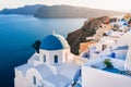 White architecture in Santorini island, Greece. Church with blue dome n Oia town Royalty Free Stock Photo