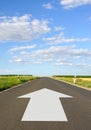 White arrow on deserted road