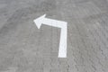 White arrow down on street tile Royalty Free Stock Photo