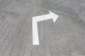 White arrow down on street tile Royalty Free Stock Photo