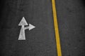 White arrow painted on asphalt road Go straight and turn right Royalty Free Stock Photo