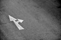 White arrow painted on asphalt road. Royalty Free Stock Photo