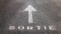 White arrow on the road indicating the exit in French Royalty Free Stock Photo