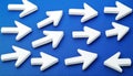 White Arrows Pointing in Different Directions on Blue Background Concept of Choice, Decisions Royalty Free Stock Photo