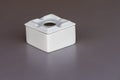 White ashtray on a table close-up Royalty Free Stock Photo