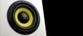 White audio speaker, isolate on a black background. Subwoofer, close-up. Minimalistic audio speaker with yellow subwoofer Royalty Free Stock Photo