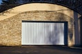 White automatic garage doors opening horizontally Royalty Free Stock Photo