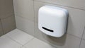 White Automatic Wall-Mounted Hand Dryer â Public Restroom Hygiene â AI content Royalty Free Stock Photo