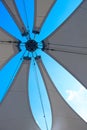 White awning with blue cloudy sky