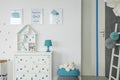 White baby bedroom with dresser Royalty Free Stock Photo