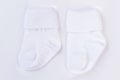 White baby wool socks on white. Royalty Free Stock Photo