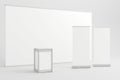 White backdrop with display counter and two blank roll-up banners Royalty Free Stock Photo