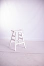 White on white. Bar stool painted white on a white background