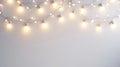 A white background adorned with string lights, creating a soft and warm ambiance Royalty Free Stock Photo
