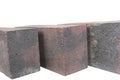 white background. brick made of concrete. multi-colored block for laying a post on the fence. close-up