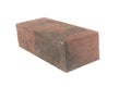 white background. brick made of concrete. multi-colored block for laying a post on the fence. close-up