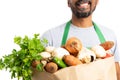 Close-up of grocery bag held by store employee