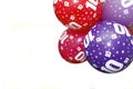 White background with colorful balloons with stars and the number 10, birthday balloons, red blue and purple, tenth anniversary