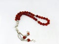 Colorful rosary varieties, white background.