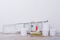 On a white background, construction materials, buckets of paint, rollers and a stepladder, there is a place for the inscription on Royalty Free Stock Photo