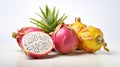 On a white background, delicious chopped and entire dragon fruits (pitahaya),