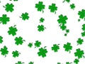 White background dotted with green clovers