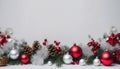 white background Extra wide Christmas border with hanging garland of fir branches, red and silver baubles, pine cones Royalty Free Stock Photo