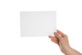 Female hand with blank invitation card on white background