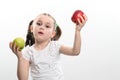 On a white background, the girl holds two green and red apples in her hands Royalty Free Stock Photo