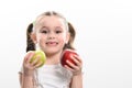 On a white background, the girl holds two green and red apples in her hands Royalty Free Stock Photo