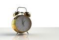 White background with golden alarm clock on table