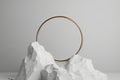 white background with golden ring, round frame integrated into chalk rock stone, aesthetic minimalist Generative AI. Royalty Free Stock Photo