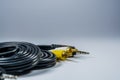 On white background hank of black cables with multi-colored plugs  tulip. Technologies. A multimedia wire for TV. Royalty Free Stock Photo