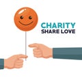 White background human hand giving a balloon form of happy face charity share love