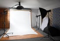 White background inside studio - lighted lamps Royalty Free Stock Photo