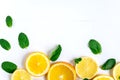 White background with lemon, orange slices and mint. Concept with fresh fruit. Lemon, Orange, Mint. View from above Royalty Free Stock Photo