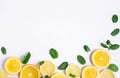 White background with lemon, orange slices and mint. Concept with fresh fruit. Lemon, Orange, Mint. View from above Royalty Free Stock Photo