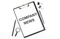 On a white background magnifier, a pen and a sheet of paper with the text COMPANY NEWS Business concept Royalty Free Stock Photo