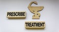 medication icon and wooden blocks with the text Prescribe treatment