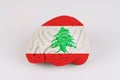On a white background, a model of the brain with a picture of a flag - Lebanon