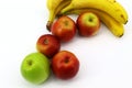 Fresh fruit on white background: bananas and apples Royalty Free Stock Photo